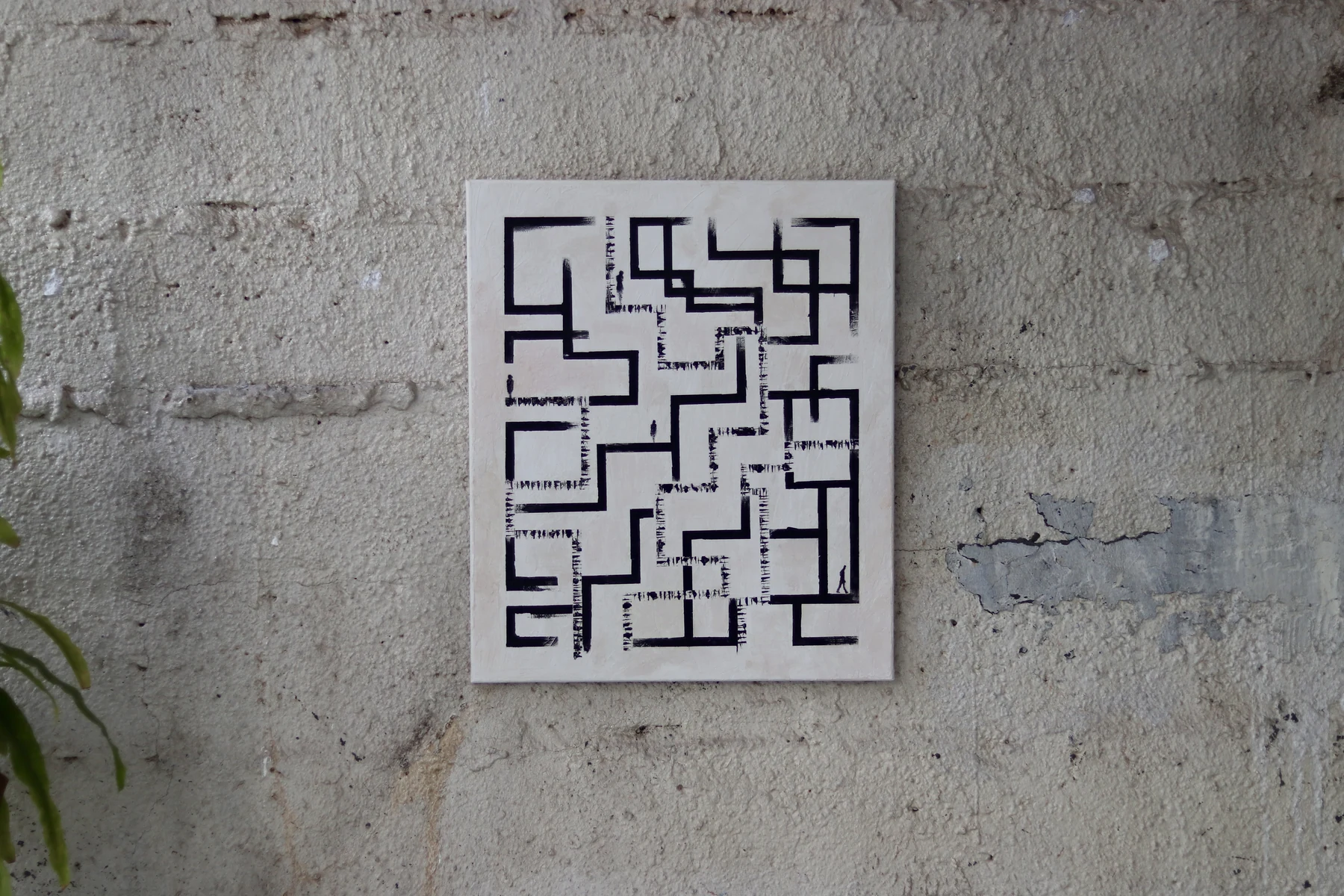 Labyrinth artwork with a black maze drawing on white paper.