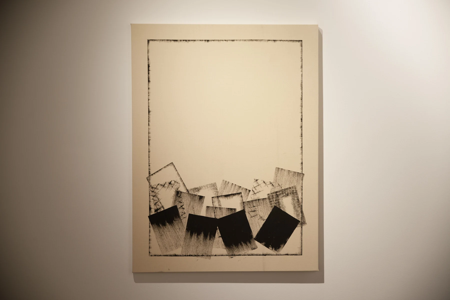 Close view of a Khalfa work with layered black forms.